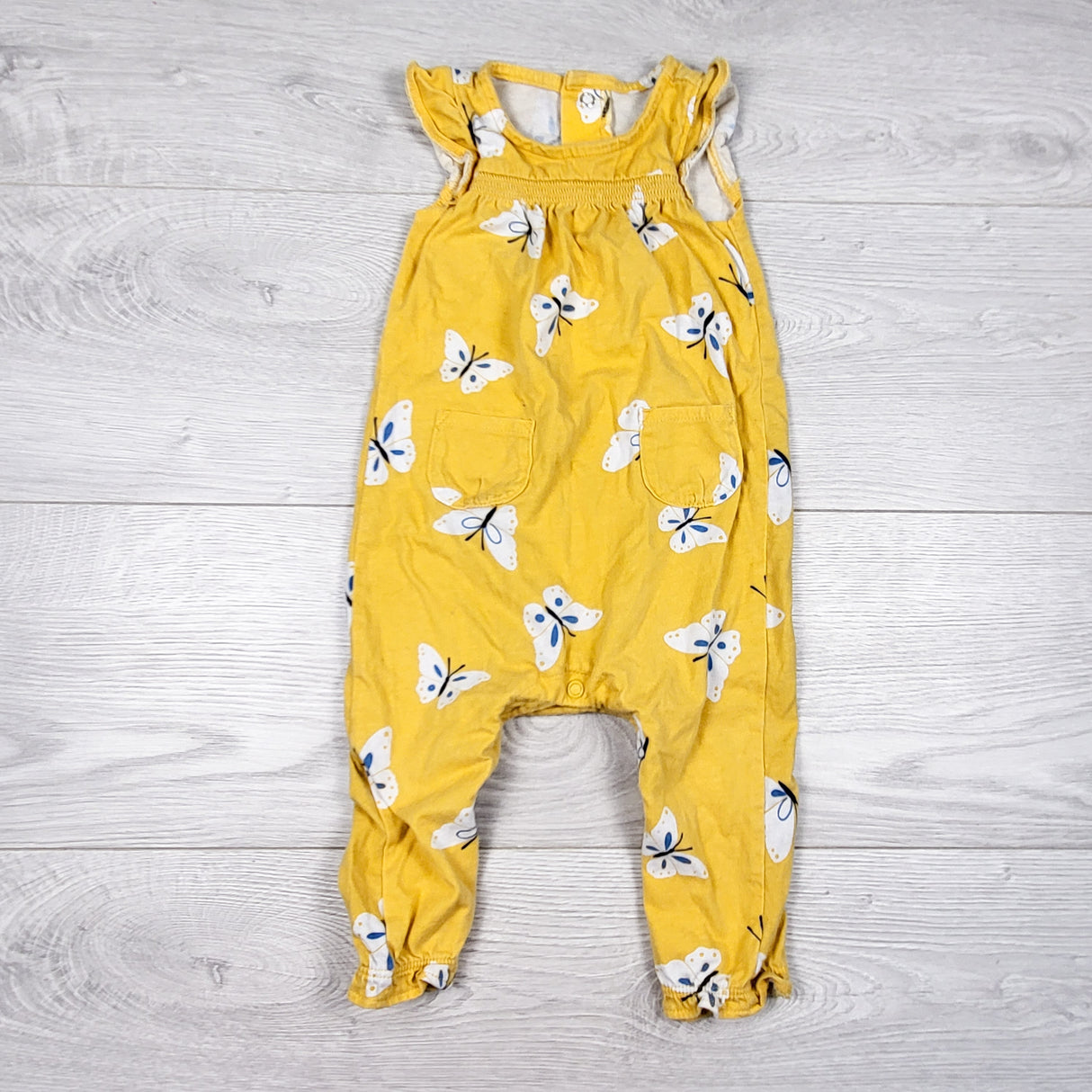 Carters yellow butterfly print romper. Size 9 months