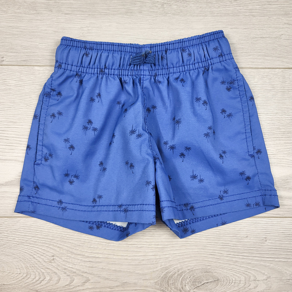 Oshkosh blue swim shorts with palm trees. Size 2T
