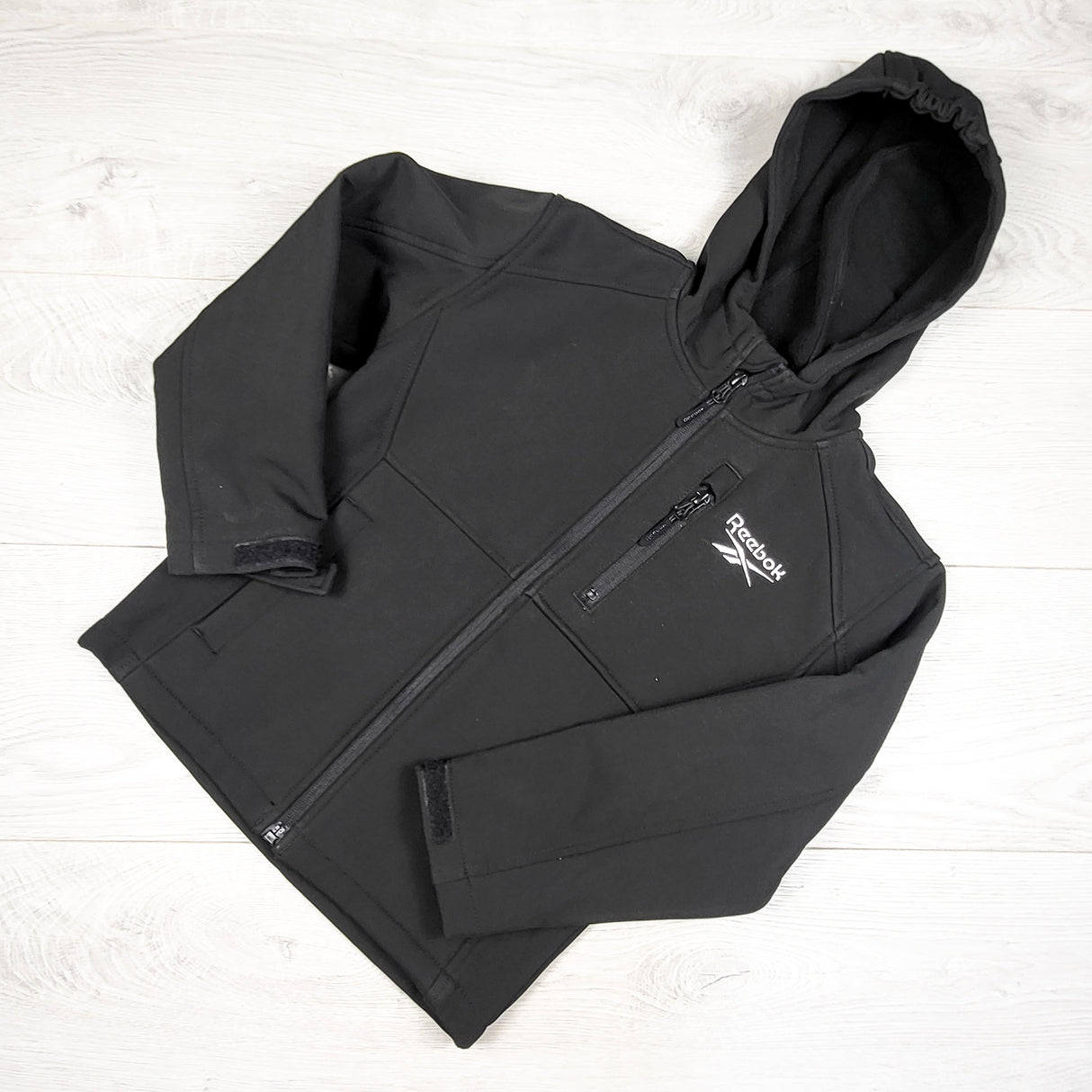 Reebook black soft shell rain jacket. Size 5/6