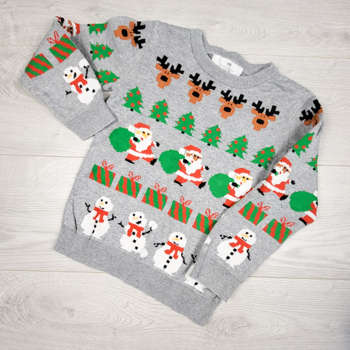 H and M grey Christmas themed sweater. Size 4-6 Years