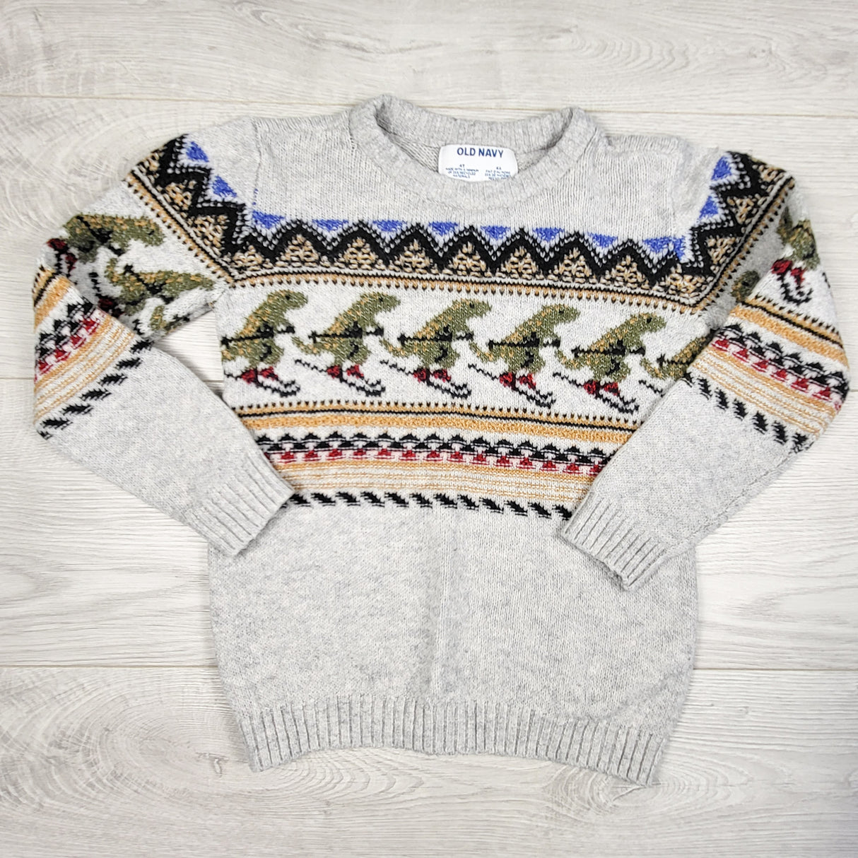 Old Navy grey sweater with skiing dinosaurs. Size 4T