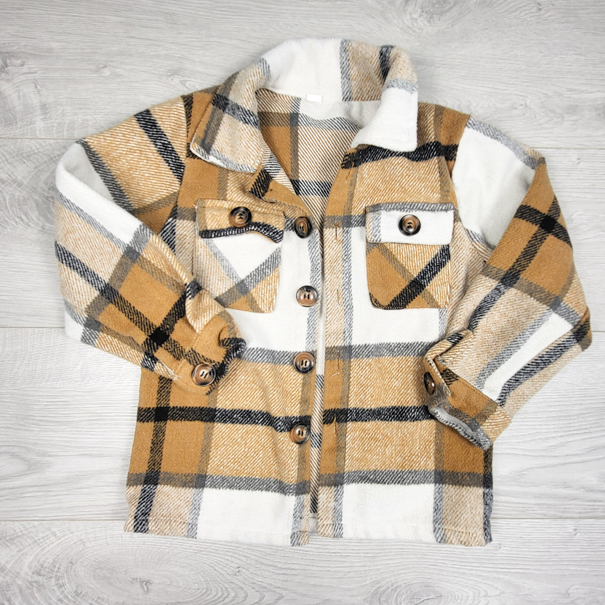 Plaid flannel button down shacket. Sizes like a 5T