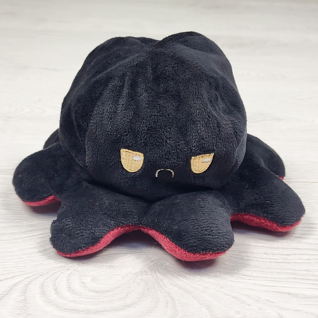 Reversible octopus plush (other side is happy)