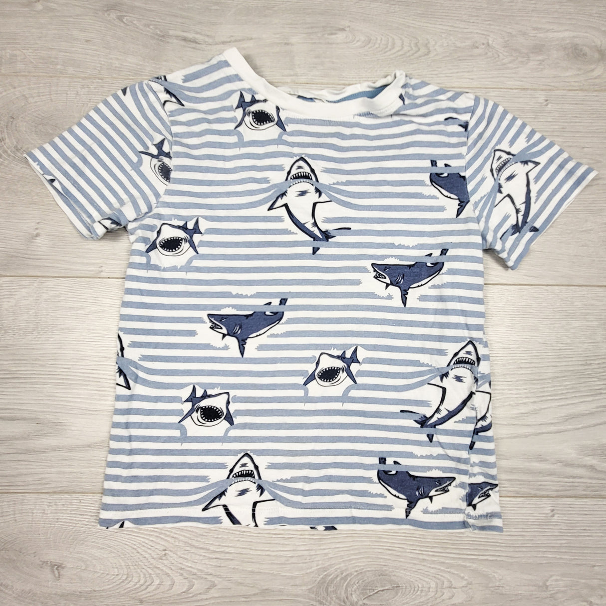 H and M blue striped t-shirt with sharks. Size 6-8 Years