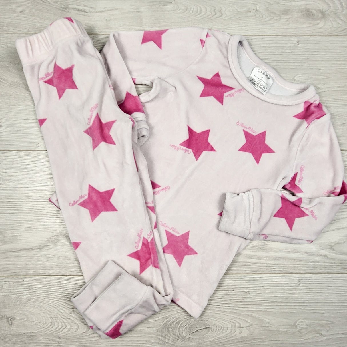 Calvin Klein pink plushy 2pc PJs with stars. Size 4T