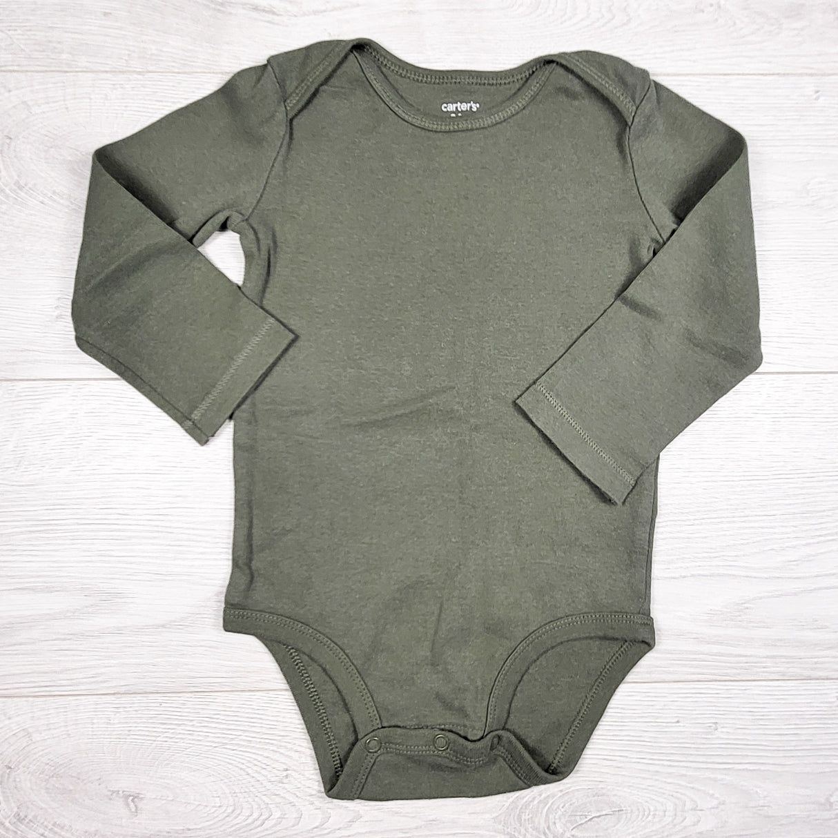 Carters green long sleeved bodysuit. Size 24 months