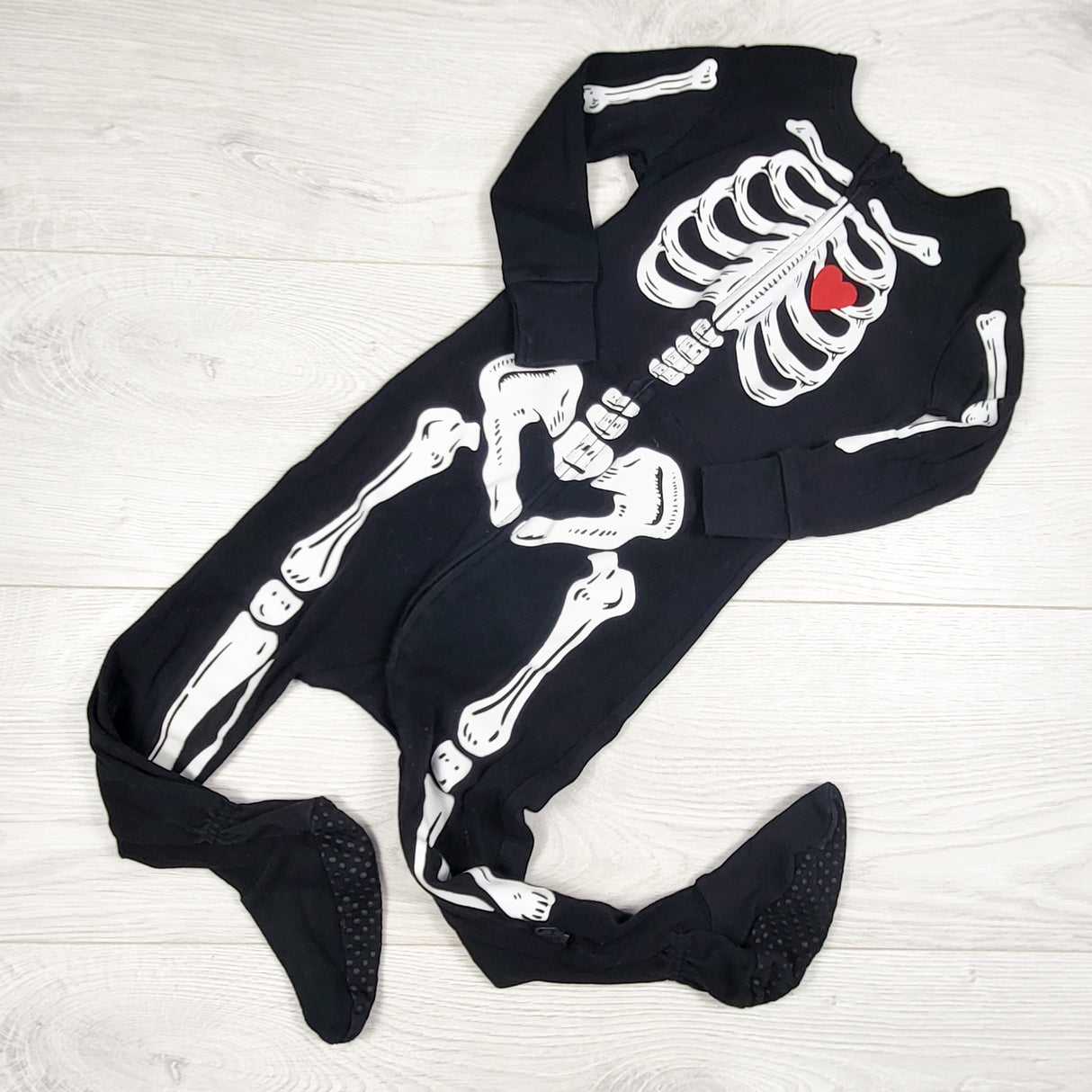 Old Navy black zippered skeleton sleeper. Size 18-24 months