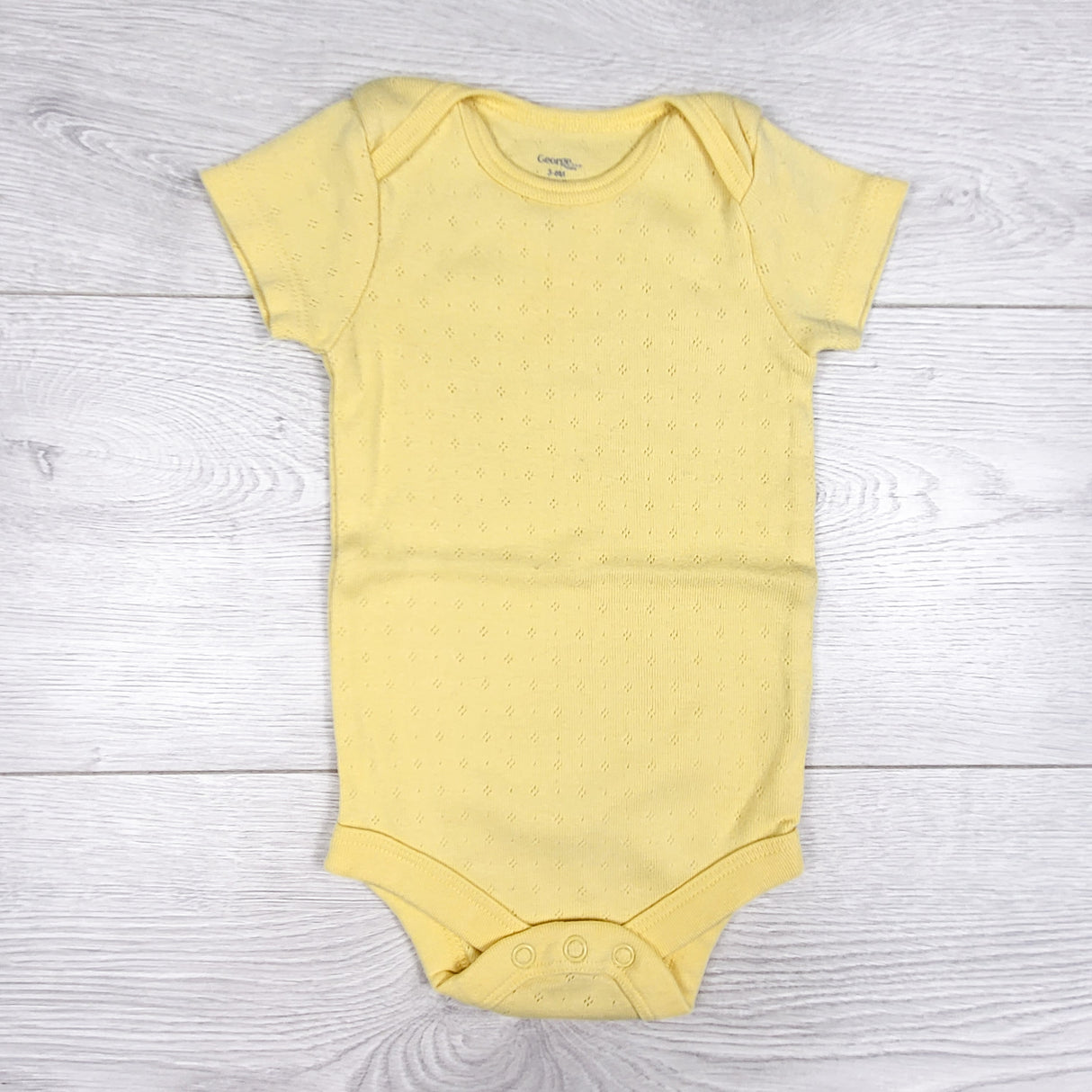 George yellow pointelle style bodysuit. Size 3-6 months