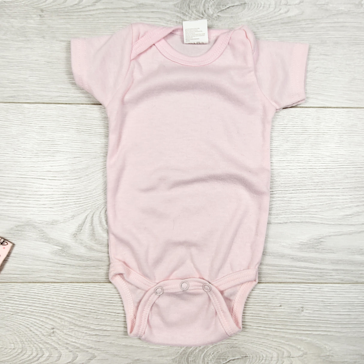 Snugly Baby light pink bodysuit. Size 0-3 months