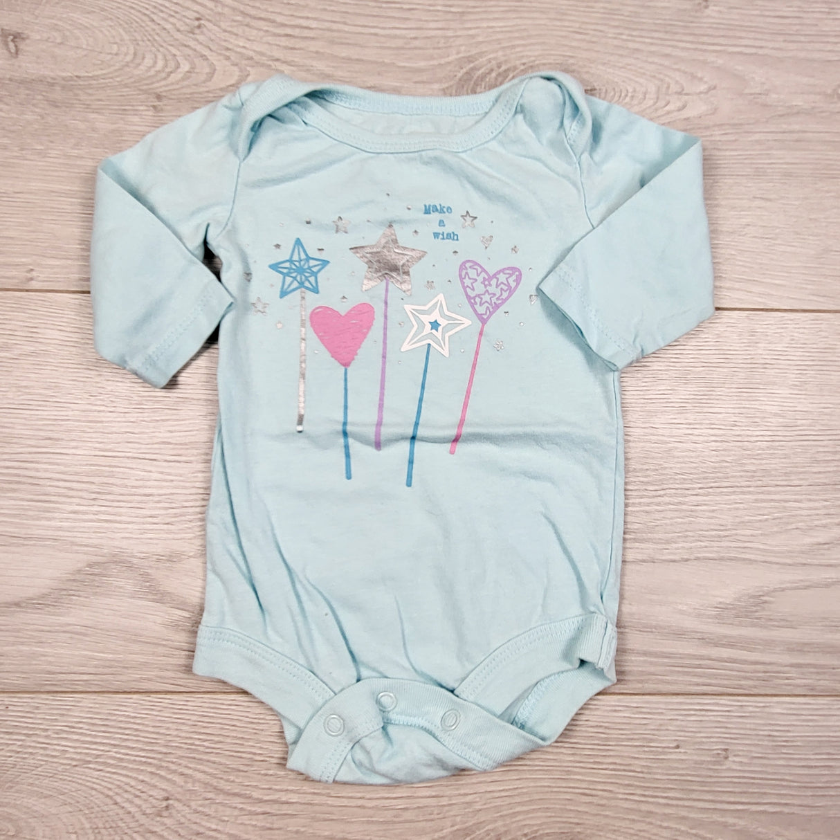 George blue bodysuit with magic wands. Size 0-3 months