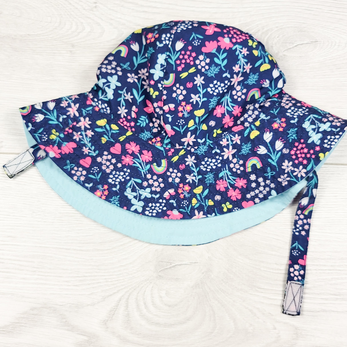 Carters navy floral print sun hat. Size 0-9 months