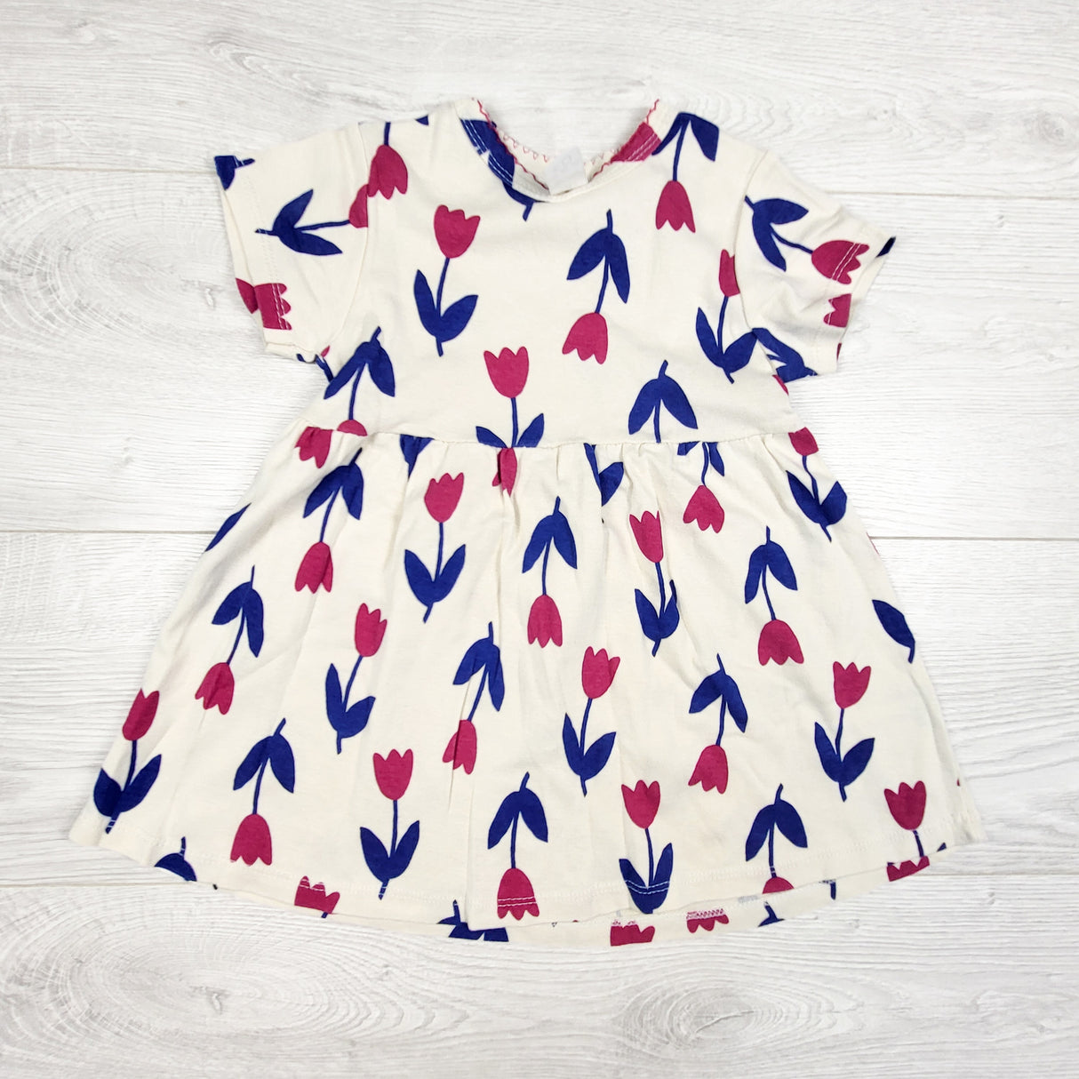 Cream coloured tulip print dress. Size 3T