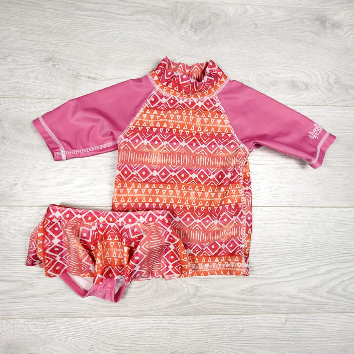 UV Skinz pink and orange patterned 2pc swim set. Size 2T