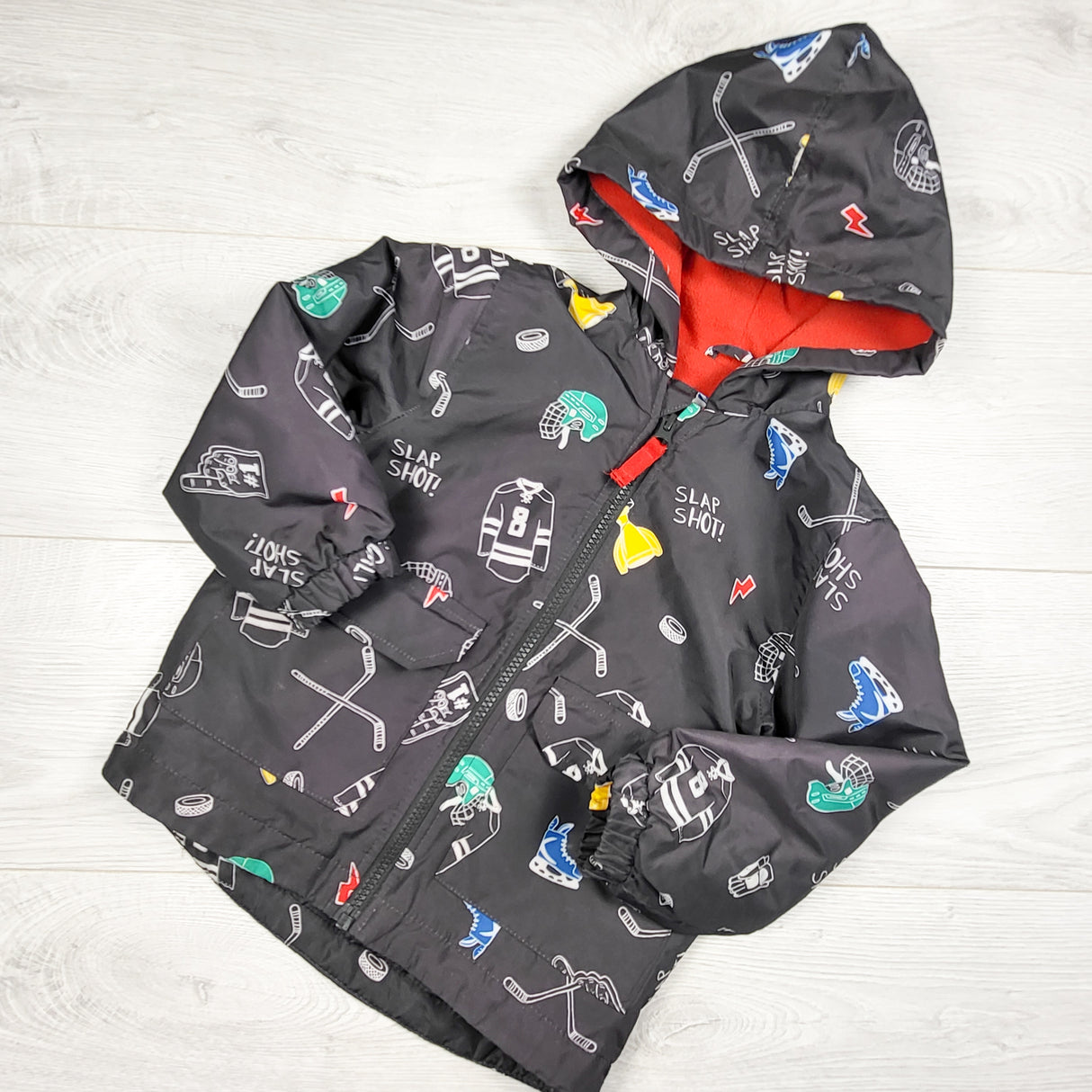 Carters grey fleece lined rain coat with hockey theme. Size 2T