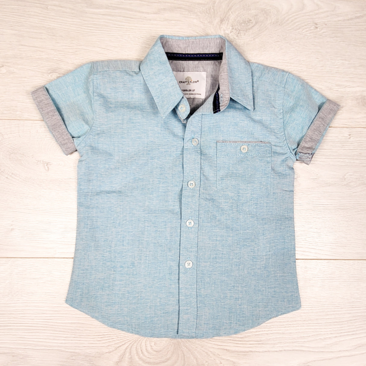 Craft Flow blue button down short sleeve shirt. Size 2T