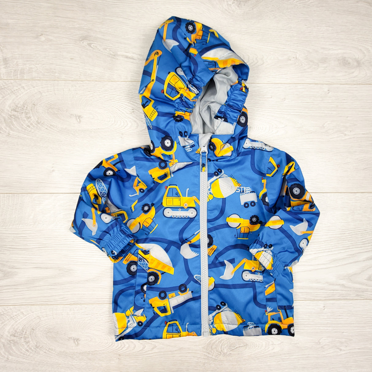 Gusti blue construction themed rain jacket. Size 12 months