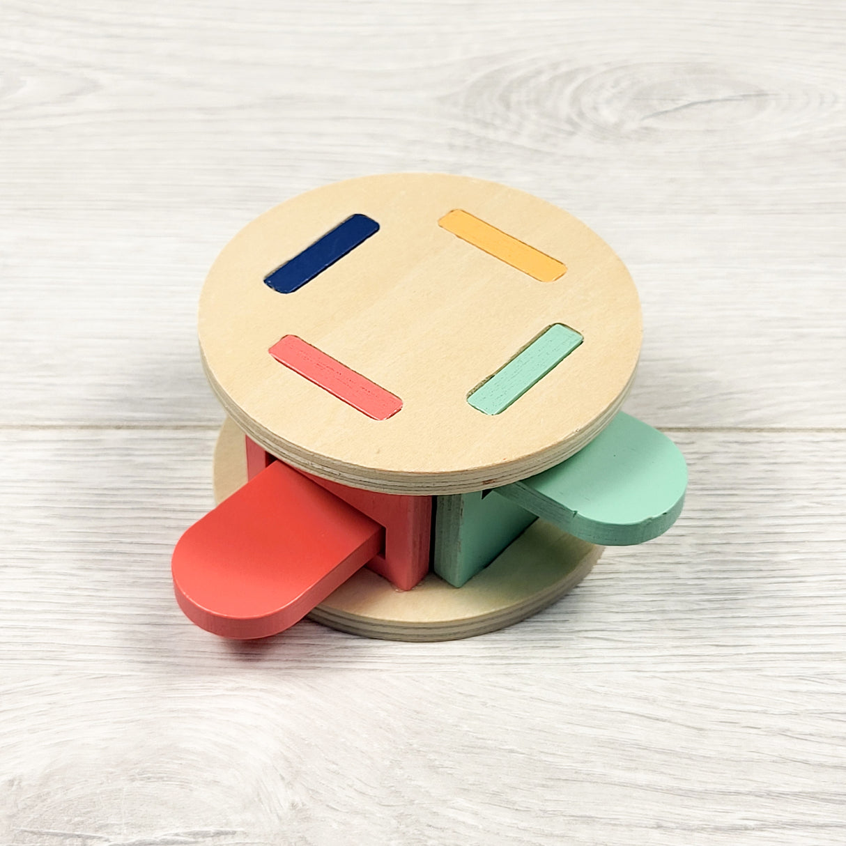KiwiCo wooden pop-it toy