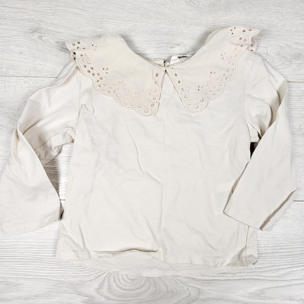 H and M beige top with eyelet collar. Size 2-4T
