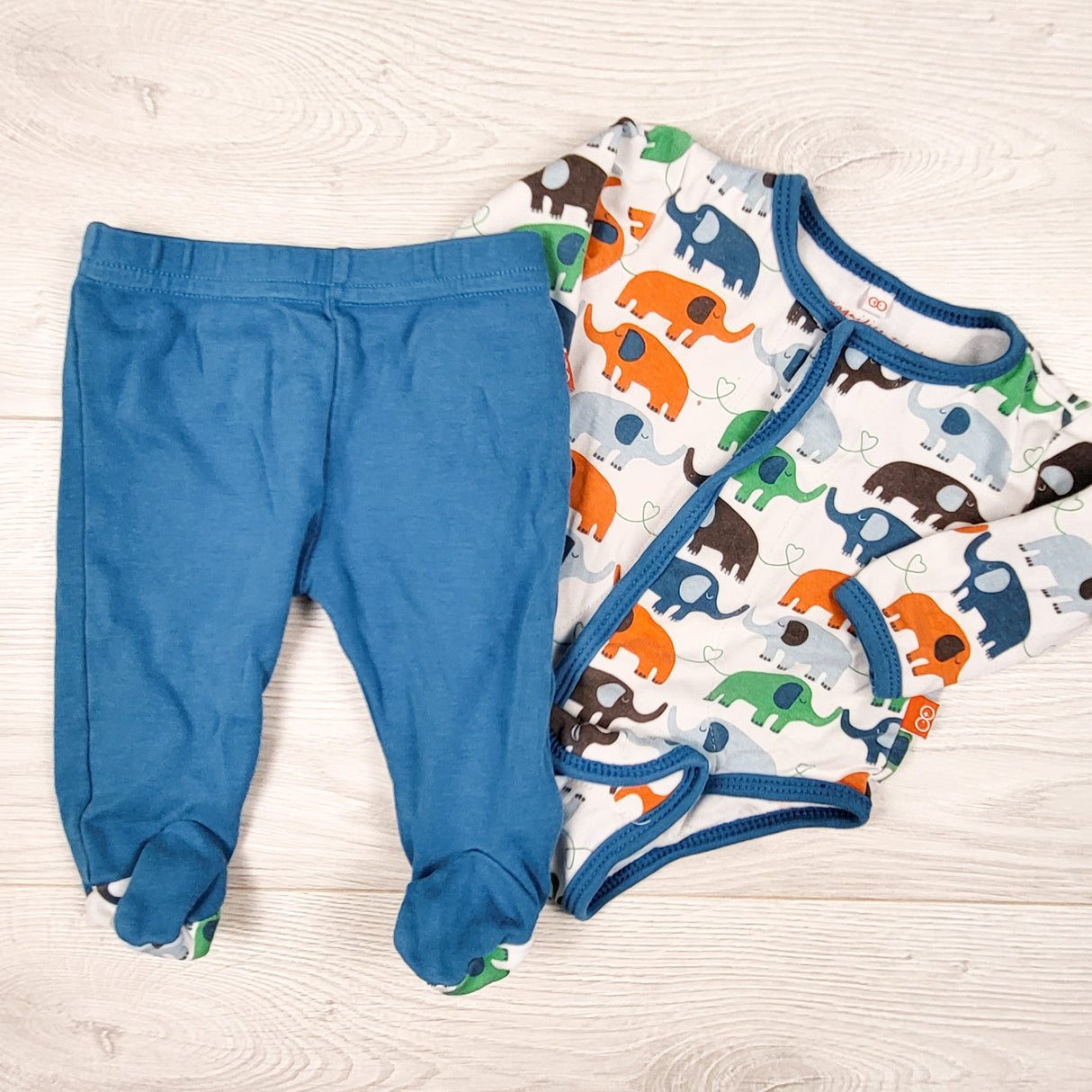 Magnificent Baby 2pc bodysuit set with magnetic closures. Newborn size