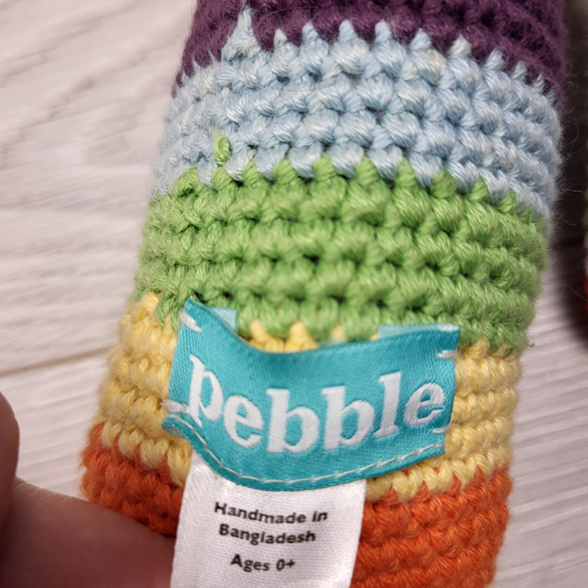 Pebble handmade fair trade rainbow bunny stick rattle