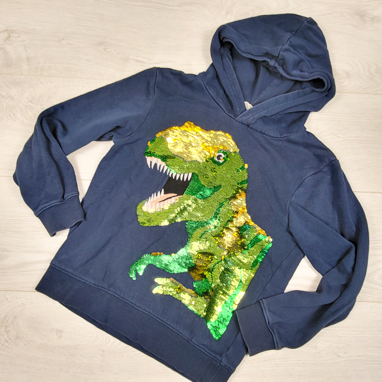 H and M blue hoodie with flip sequin dinosaur. Size 6-8 Years