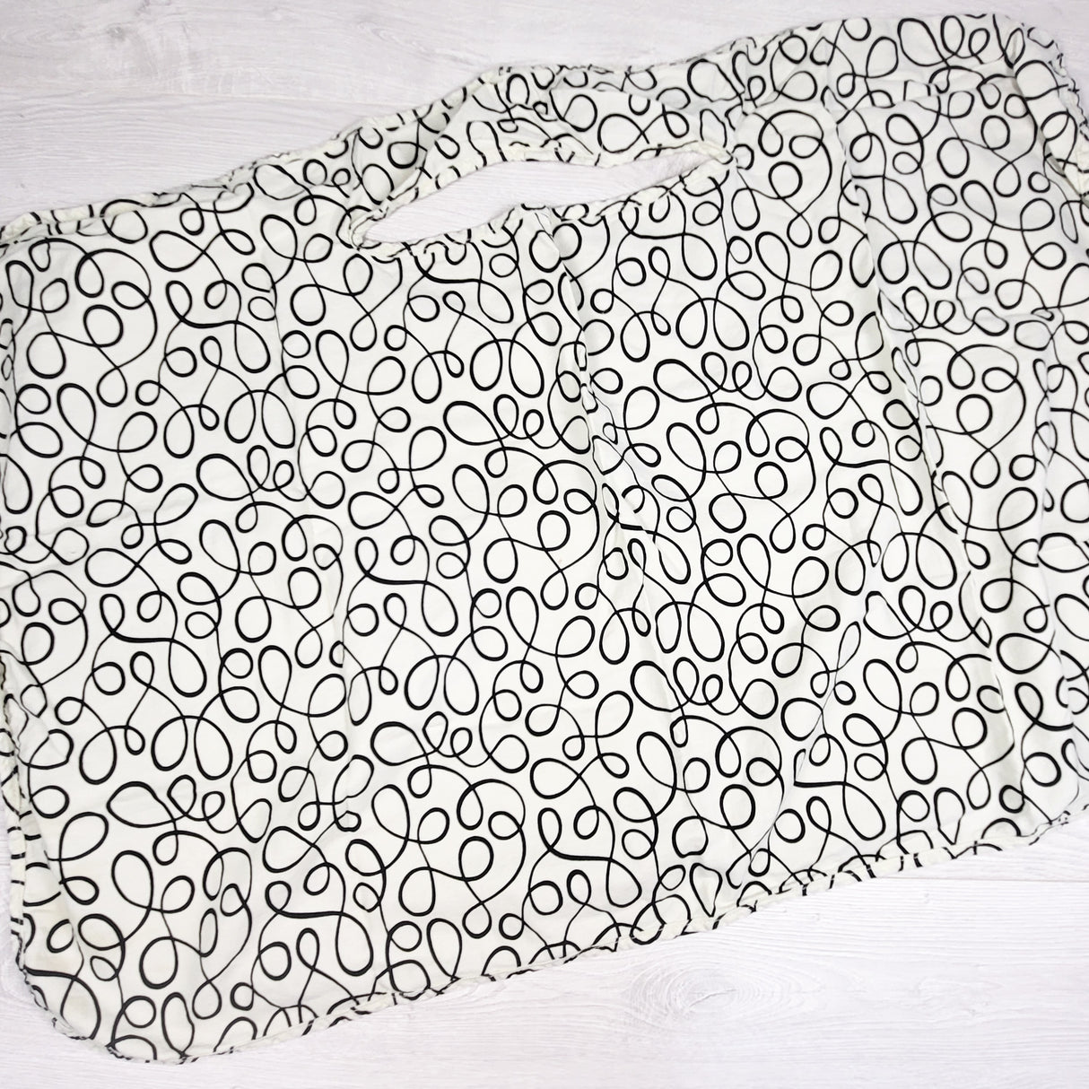 Pale yellow patterned nursing cover