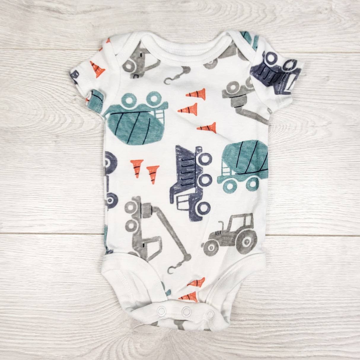 Child of Mine white construction themed bodysuit. Newborn size