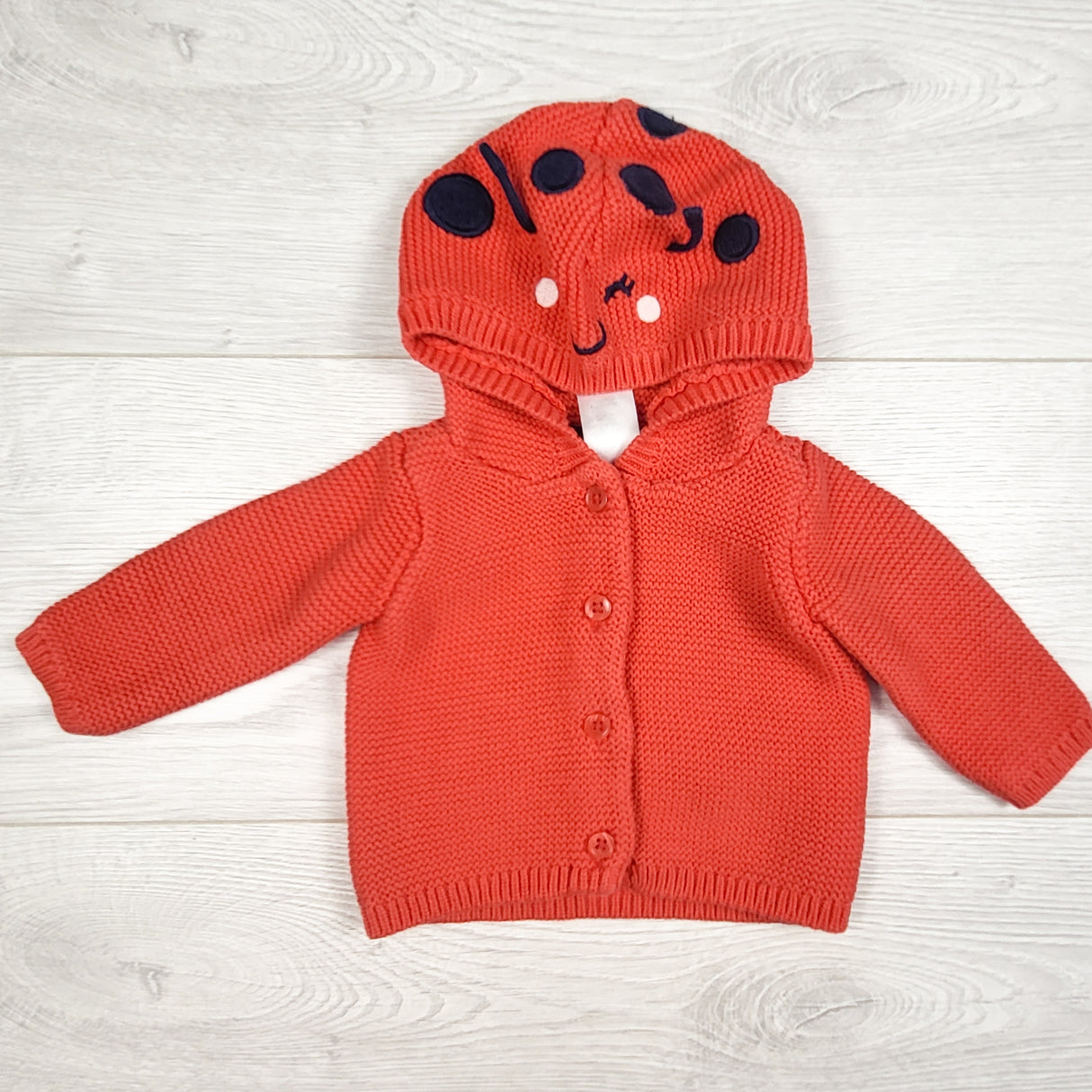 Carters pinky-red ladybug hooded sweater. Size newborn