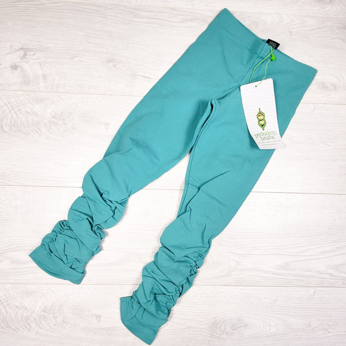 NEW - Peekaboo Beans aqua "Long Embrace" ruched leggings. Size 7