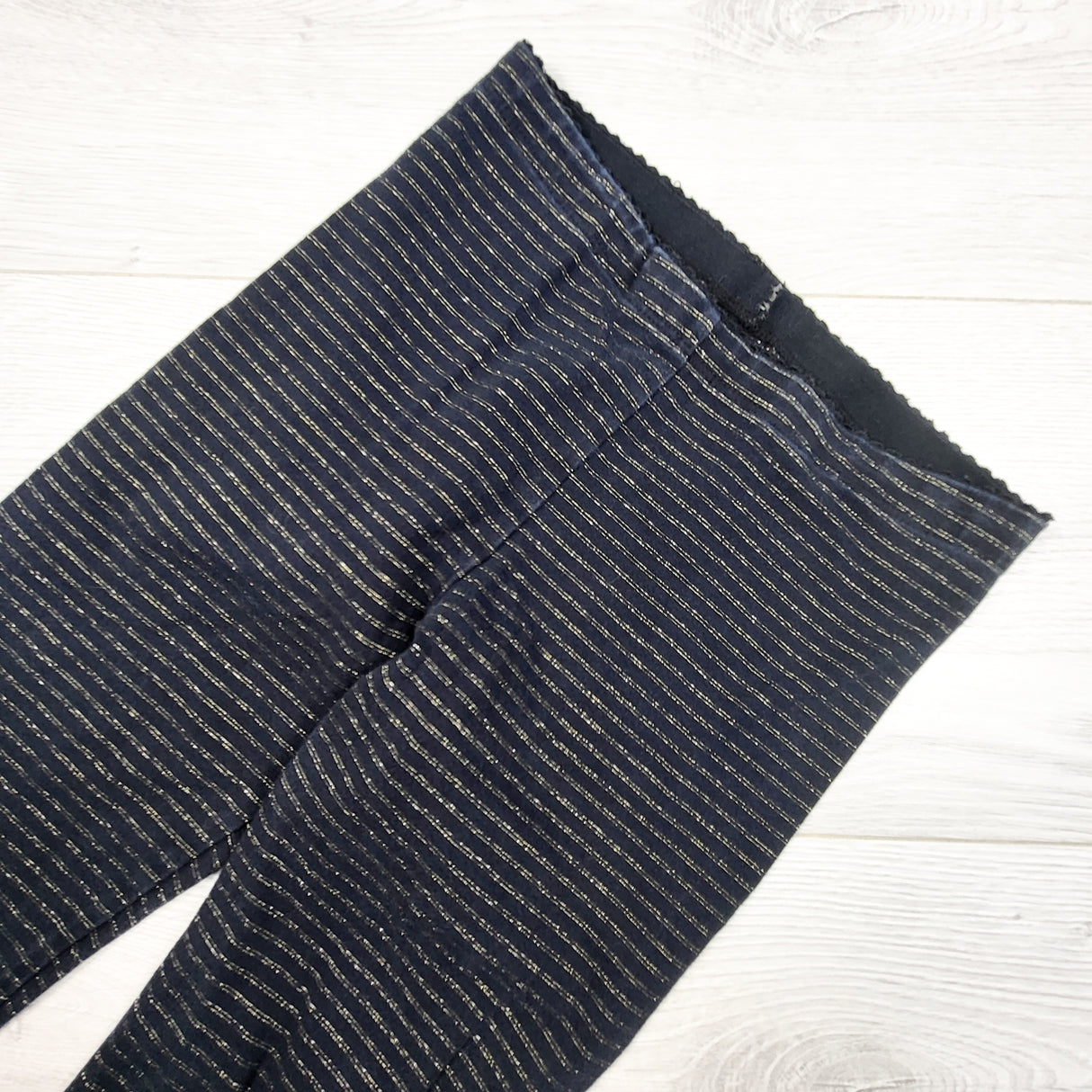 Tea Collection black and gold striped leggings. Size 7