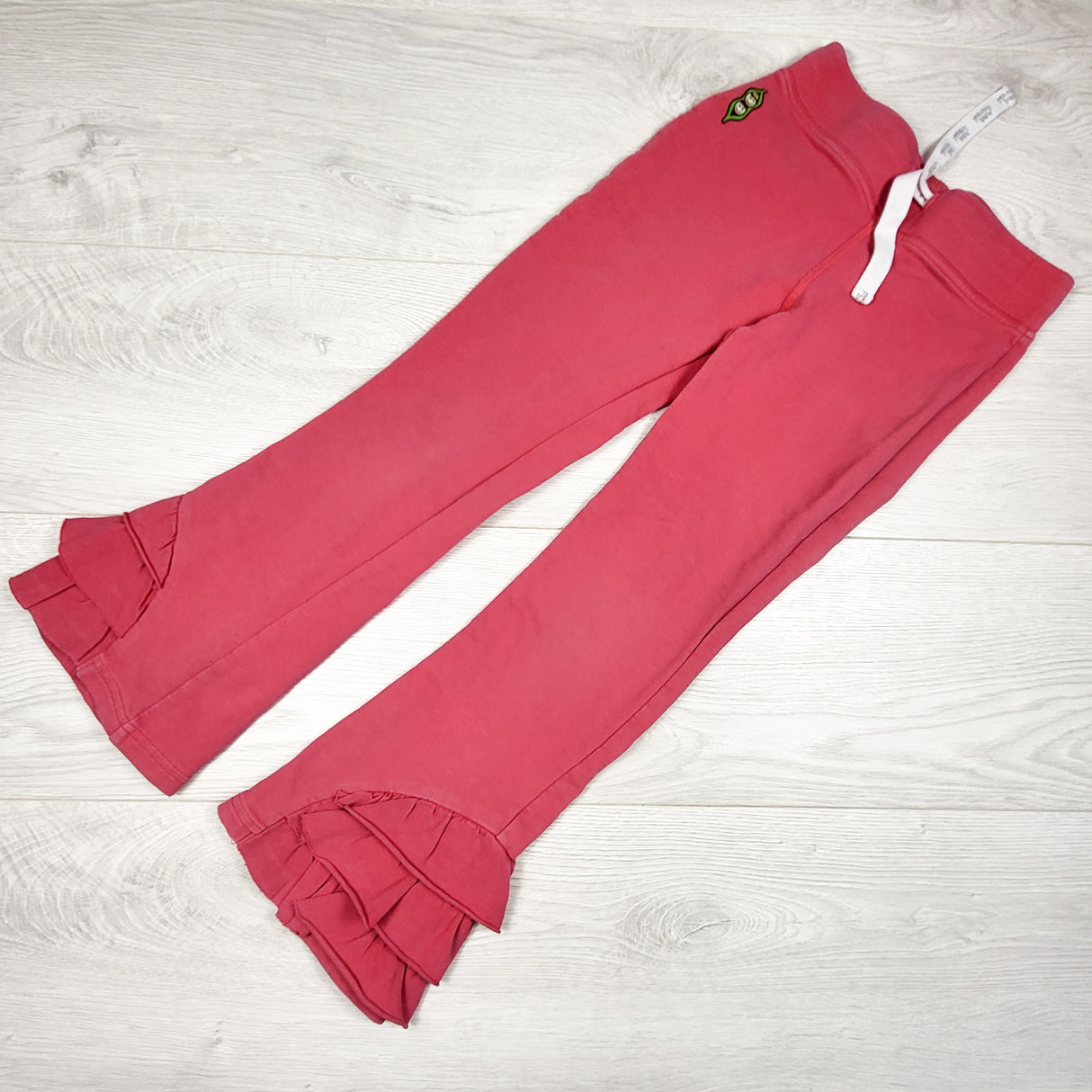 Peekaboo Beans pink drawstring pants with ruffles. Size 7