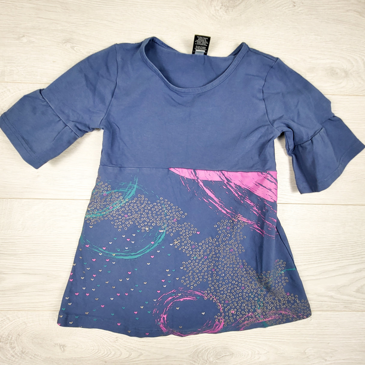 Peekaboo Beans blue patterned top with ruffle top. Size 7
