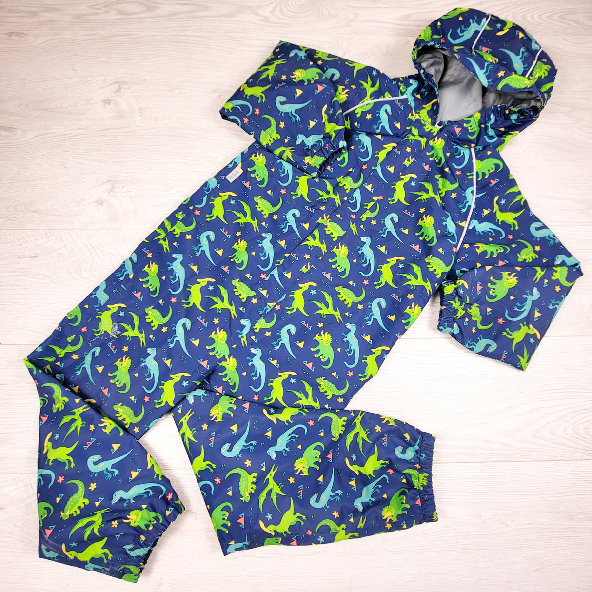 Jan and Jul navy dinosaur print one piece rain suit. Size 6