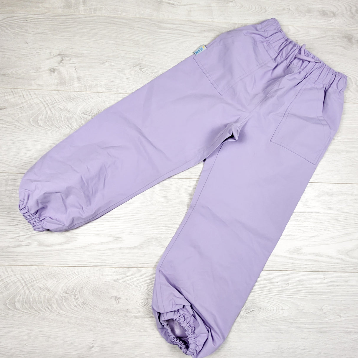 Jan and Jul purple single layer rain pants. Size 5/6