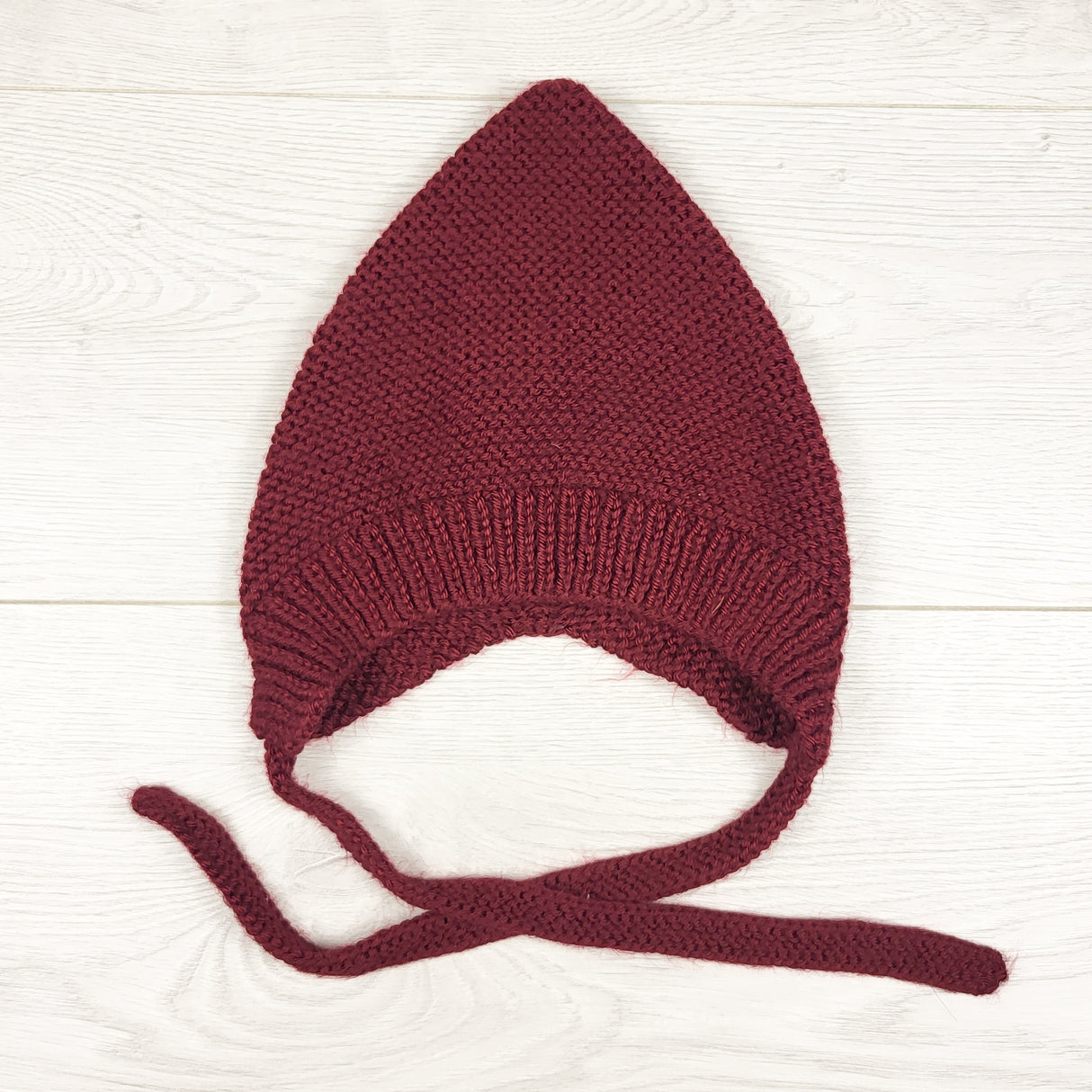 Handmade burgundy pixie hat. Seems toddler sized