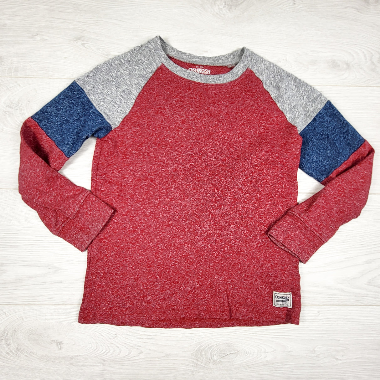 Oshkosh red knit long sleeve shirt. Size 8