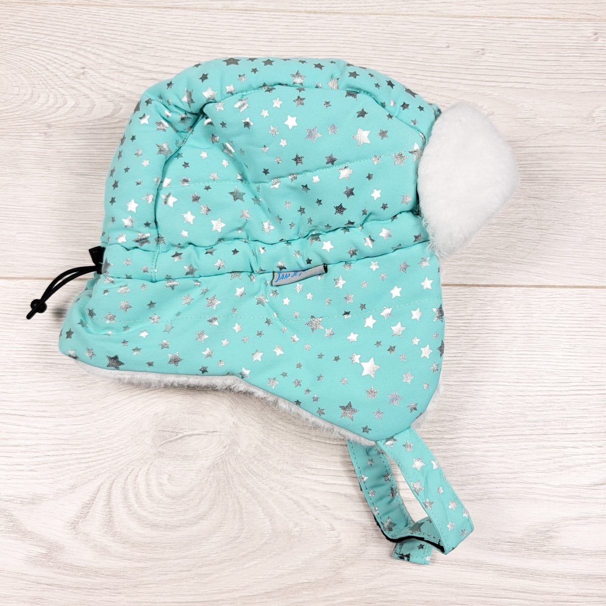 Jan and Jul turquoise trapper hat with stars. Size large (2 to 5T)