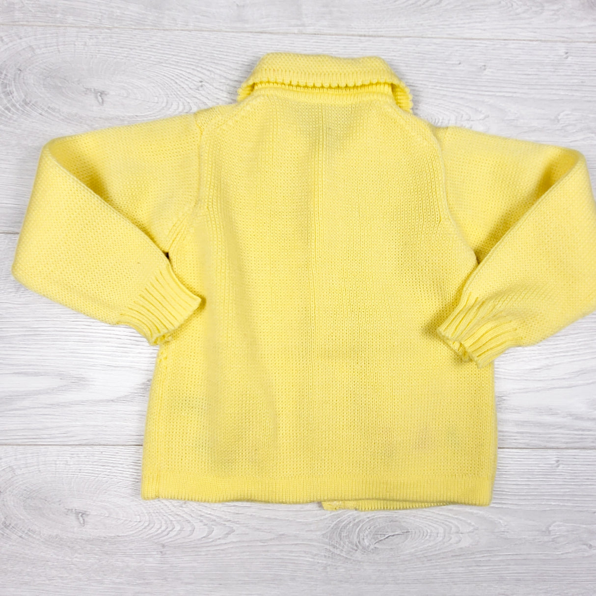 Handmade yellow snap button sweater. Approx 2T