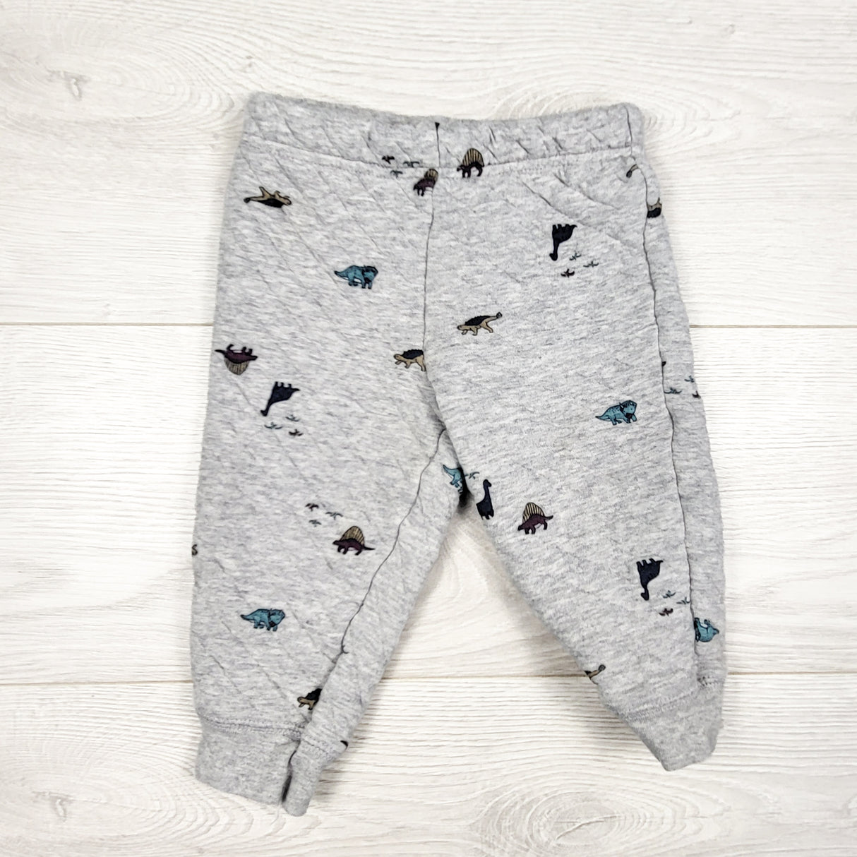 Carters grey quilted dinosaur print pants. Size 12 months