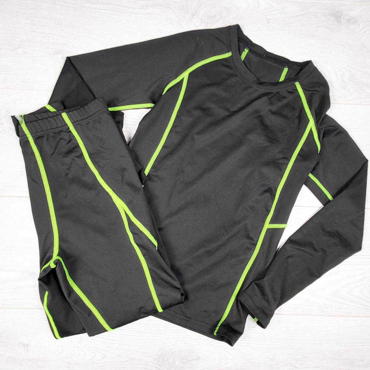 Black and yellow 2pc base layer / compression set. Size 10
