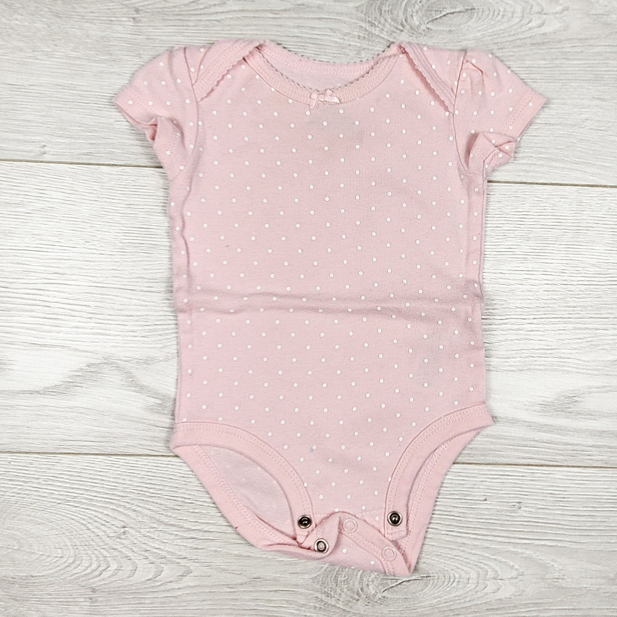 Carters light pink polka dot bodysuit. Size 3 months