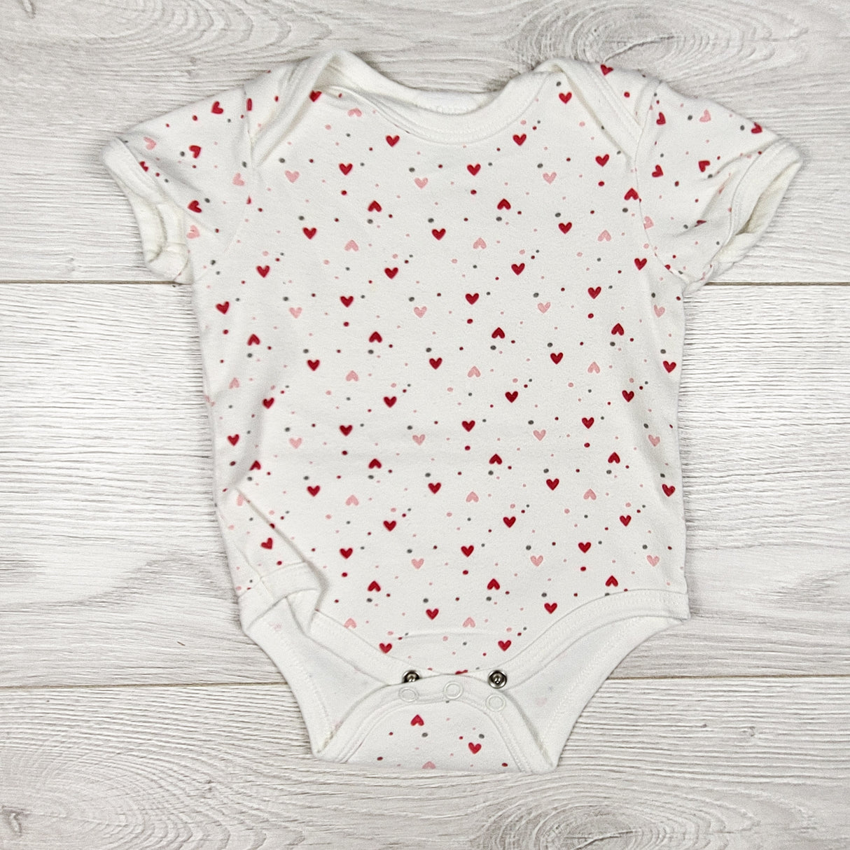 Baby Mode white heart print bodysuit. Size 6-9 months