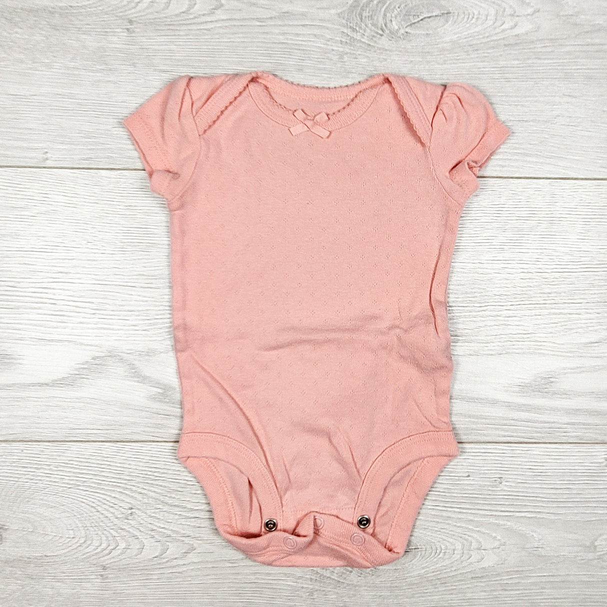Little Planet pink pointelle style bodysuit. Size 3 months