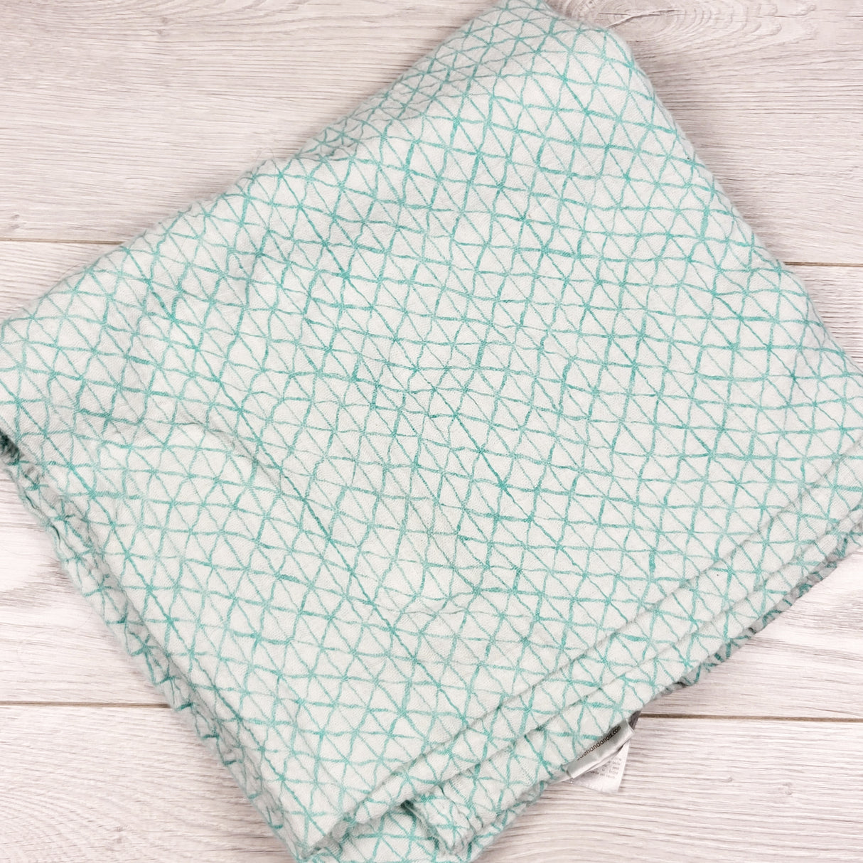 Aiden and Anais turquoise patterned muslin swaddle blanket