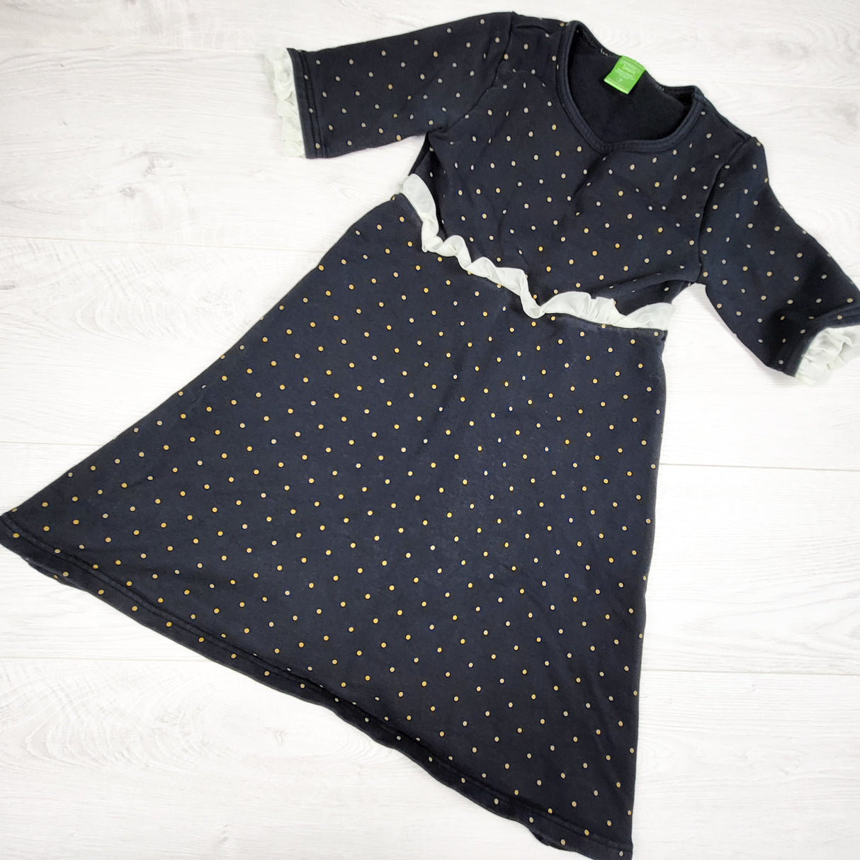 Peekaboo Beans black and gold polka dot dress with ruffle. Size 7