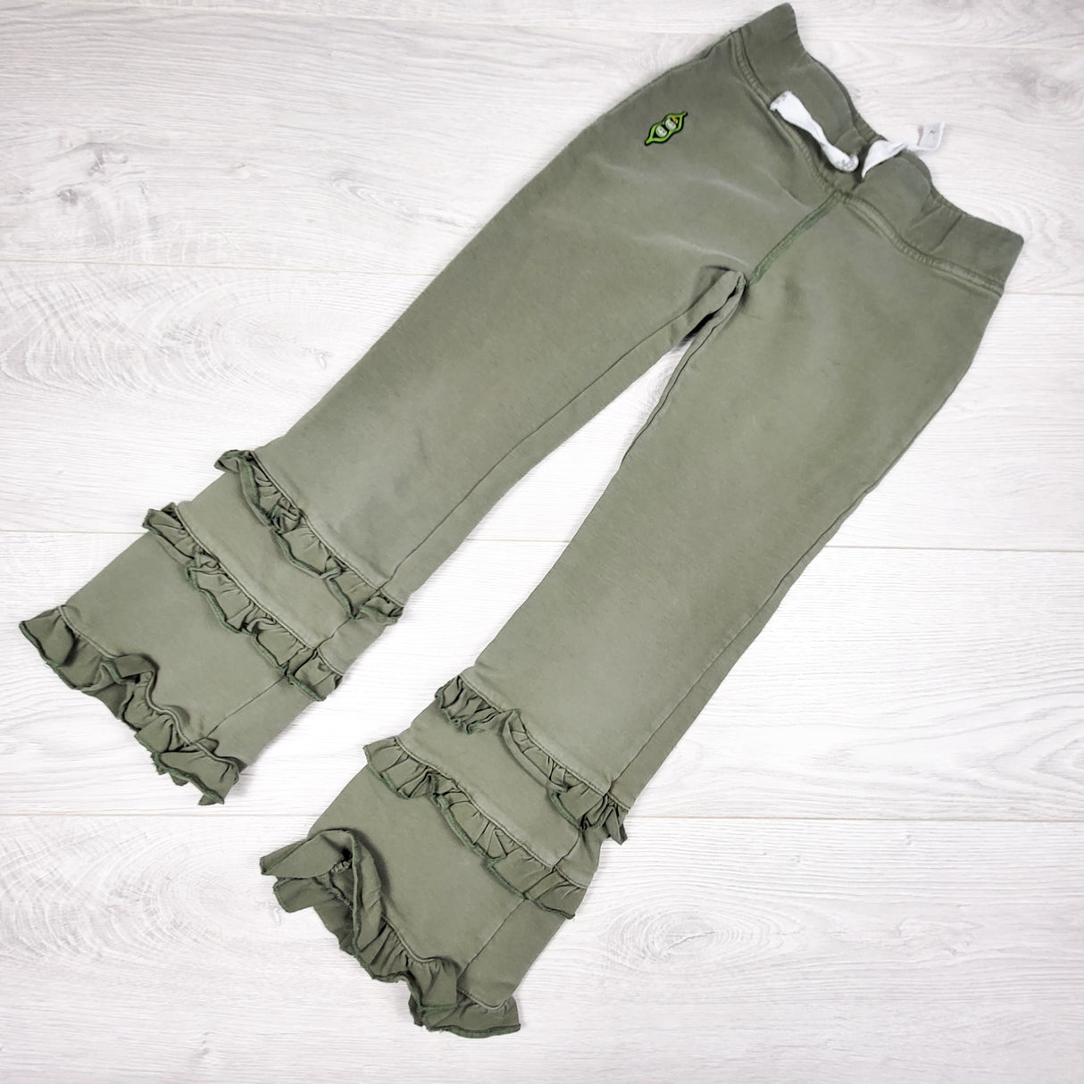 Peekaboo Beans olive green ruffle pants. Size 7