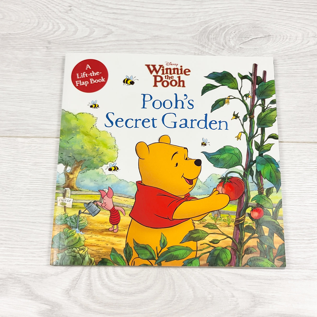 Pooh's Secret Garden. Soft covr lift the flap book