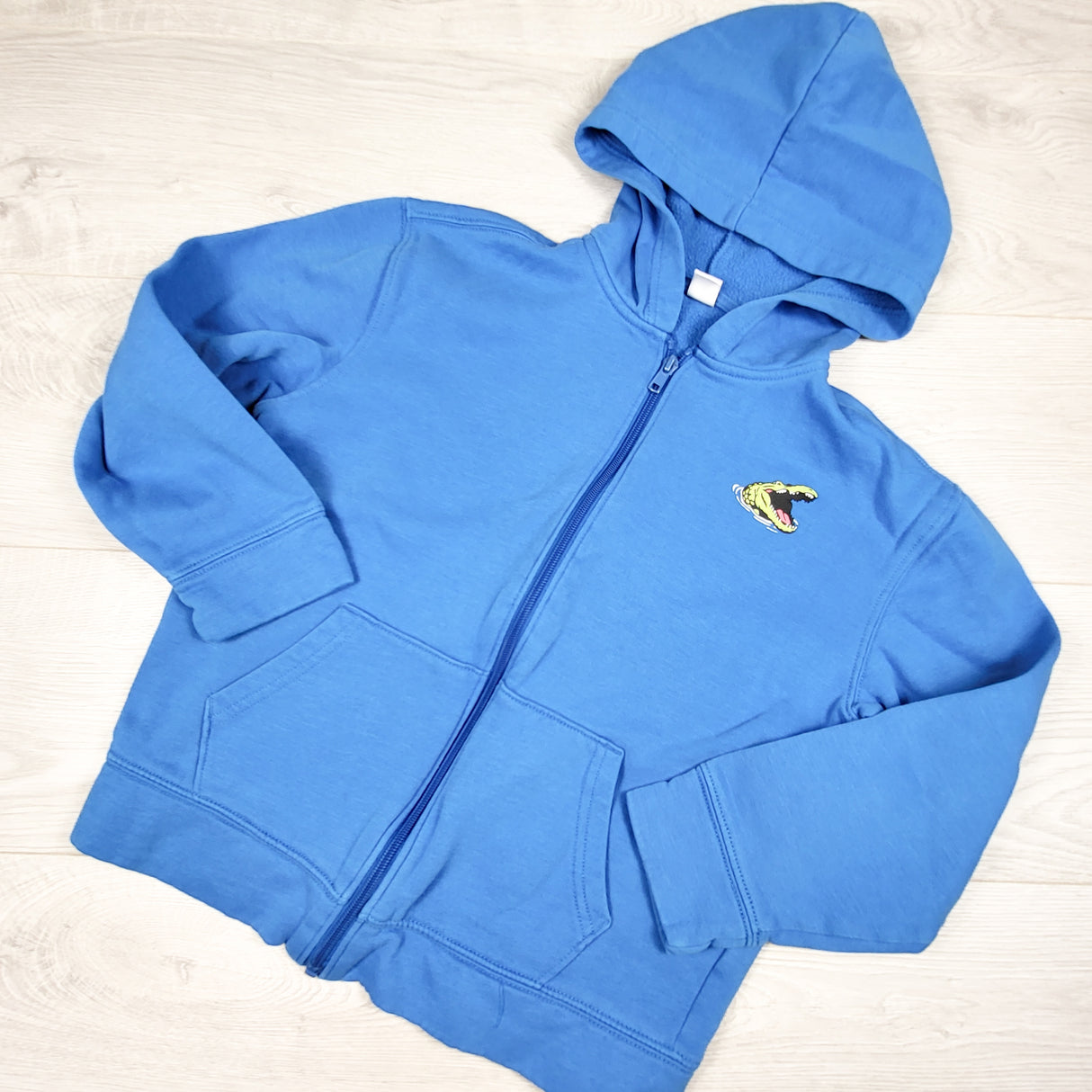 Old Navy blue zip up hoodie with dinosaur. Size 10/12