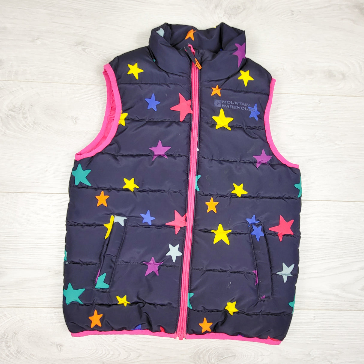 Mountain Warehouse navy star print quilted vest. Size 5/6