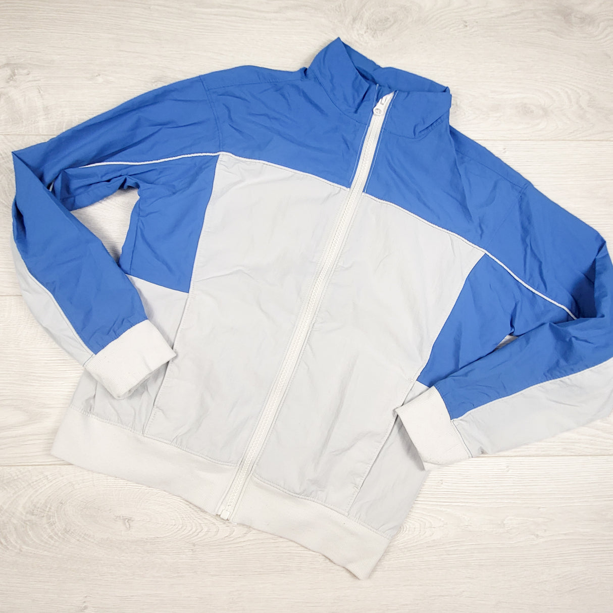 Old Navy blue and white retro look zip up windbreaker. Size 10/12